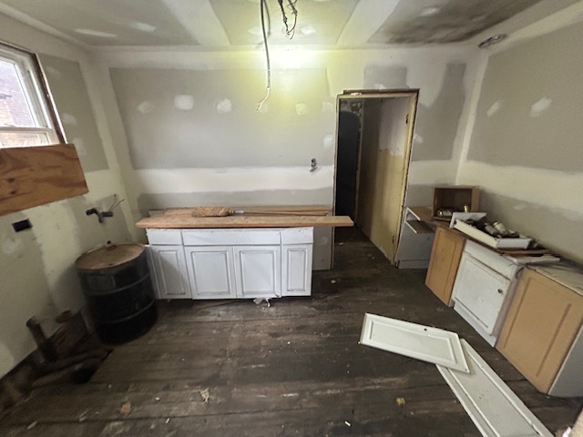 10230 South Union Avenue Chicago, IL 60628 - Photo 13 of 28 a view of kitchen with refrigerator stove and wooden floor