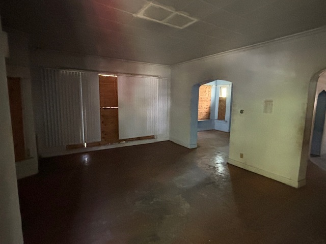 10230 South Union Avenue Chicago, IL 60628 - Photo 15 of 28 an empty room with wooden floor and windows
