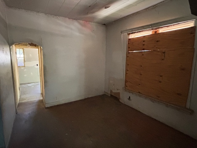 10230 South Union Avenue Chicago, IL 60628 - Photo 20 of 28 an empty room with wooden floor and windows