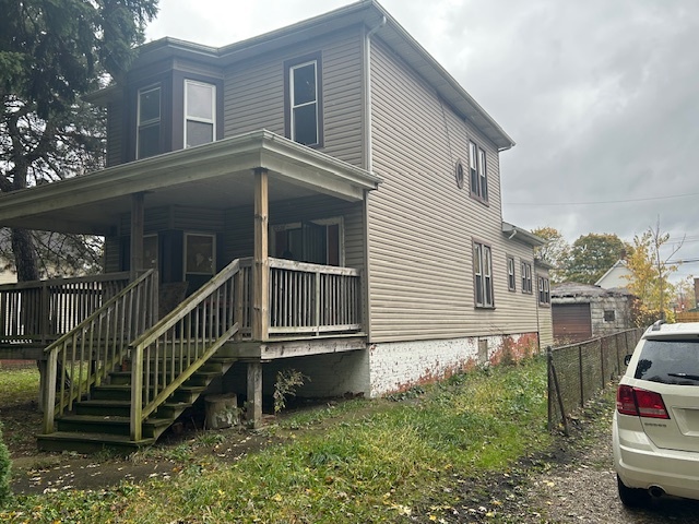 10230 South Union Avenue Chicago, IL 60628 - Photo 2 of 28 a backyard of a house with a deck