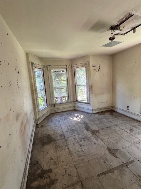 10230 South Union Avenue Chicago, IL 60628 - Photo 23 of 28 an empty room with windows