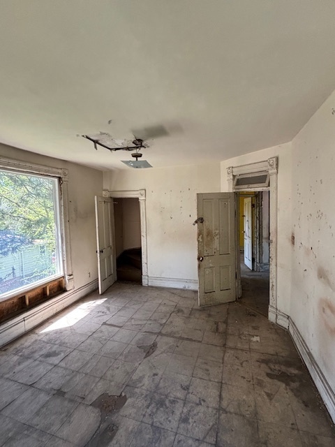 10230 South Union Avenue Chicago, IL 60628 - Photo 24 of 28 en empty room with windows and fireplace
