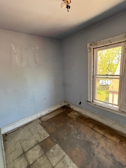 10230 South Union Avenue Chicago, IL 60628 - Photo 26 of 28 an empty room with a window