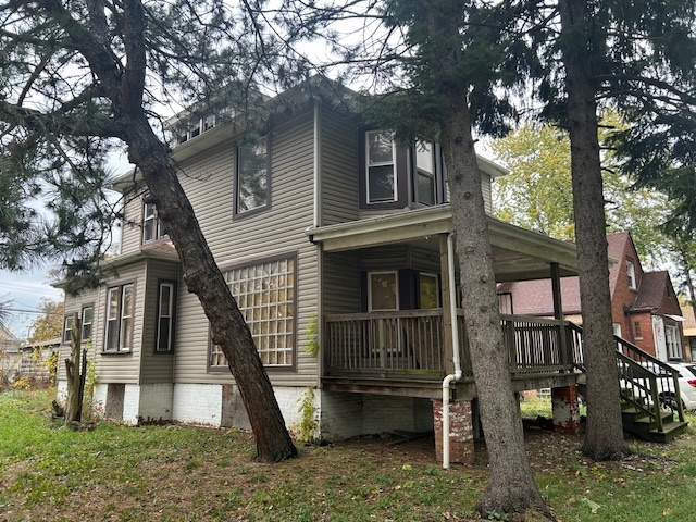 10230 South Union Avenue Chicago, IL 60628 - Photo 3 of 28 a front view of a house with a yard