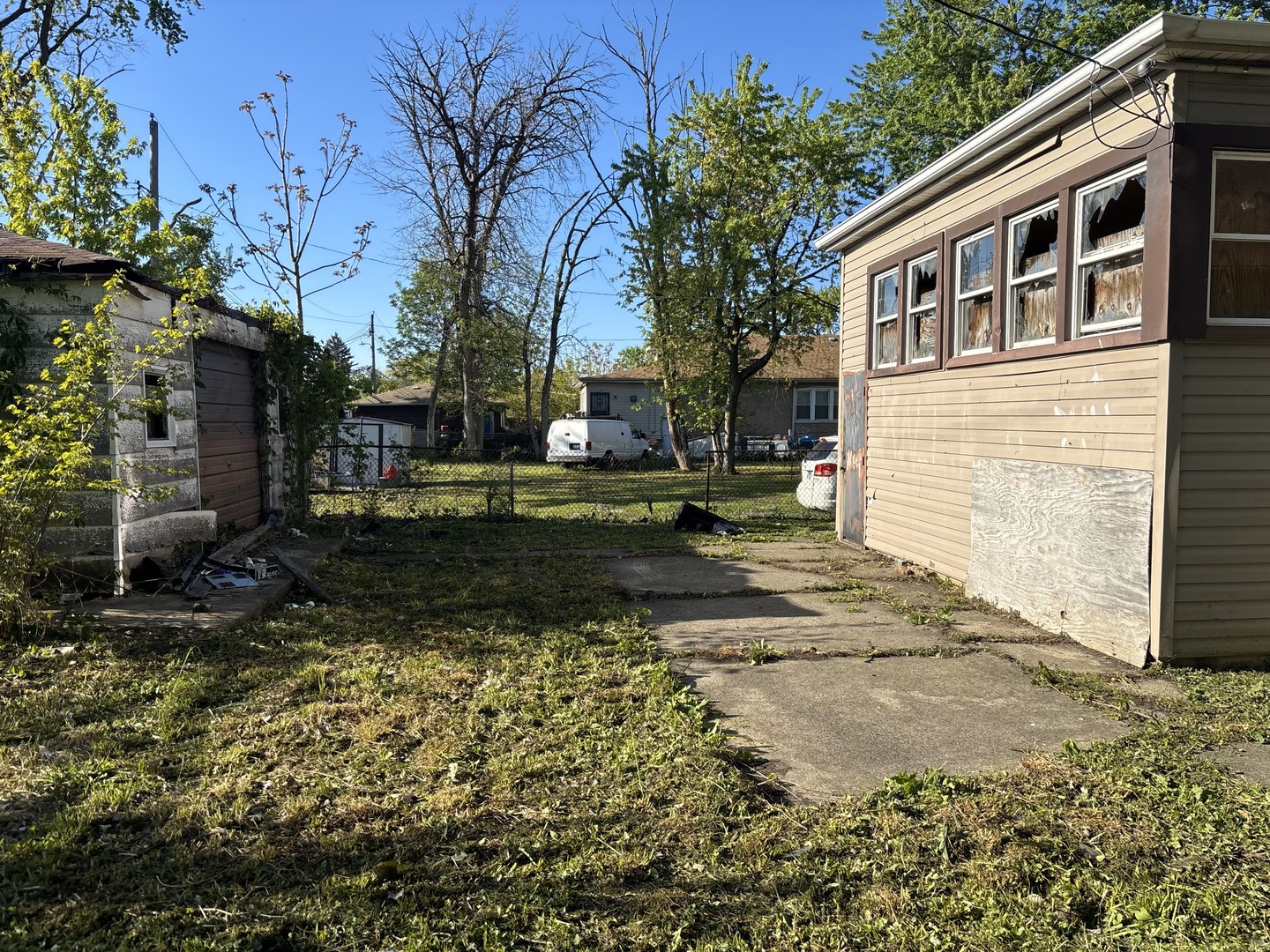 10230 South Union Avenue Chicago, IL 60628 - Photo 6 of 28 a view of a house with a yard