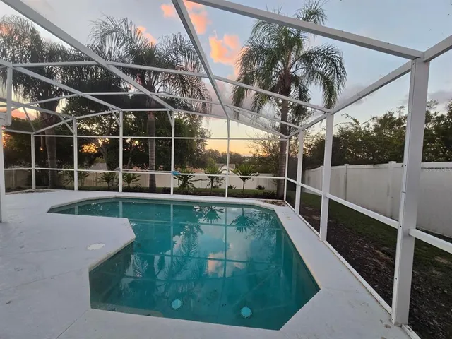 a view of a swimming pool with a patio