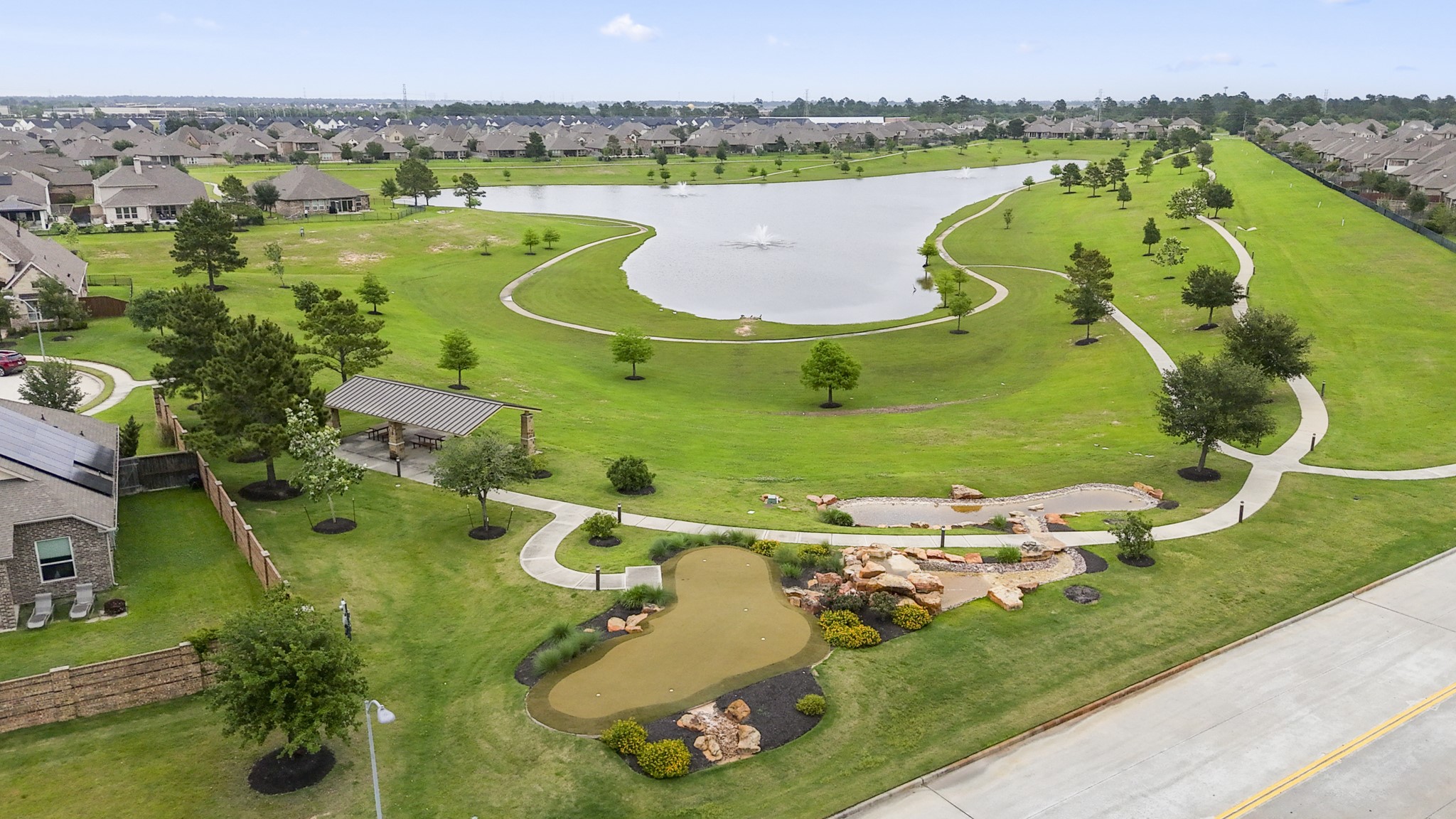 7502 Windsor Park Court Spring, TX 77379 - Photo 47 of 50 The Laurel Park amenities continue with scenic ponds, winding walking trails, shaded pavilion space, and open green areas that make the neighborhood feel connected well beyond your own backyard.