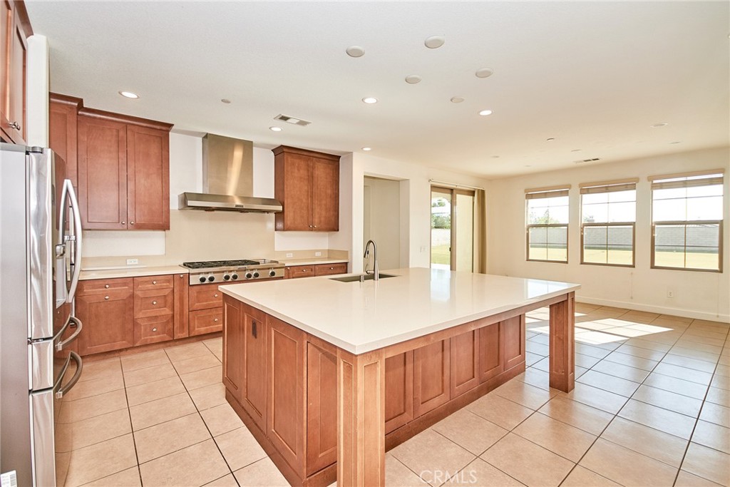 245 Snapdragon Lane Glendora, CA 91741 - Photo 19 of 42 a kitchen with stainless steel appliances a sink stove and cabinets