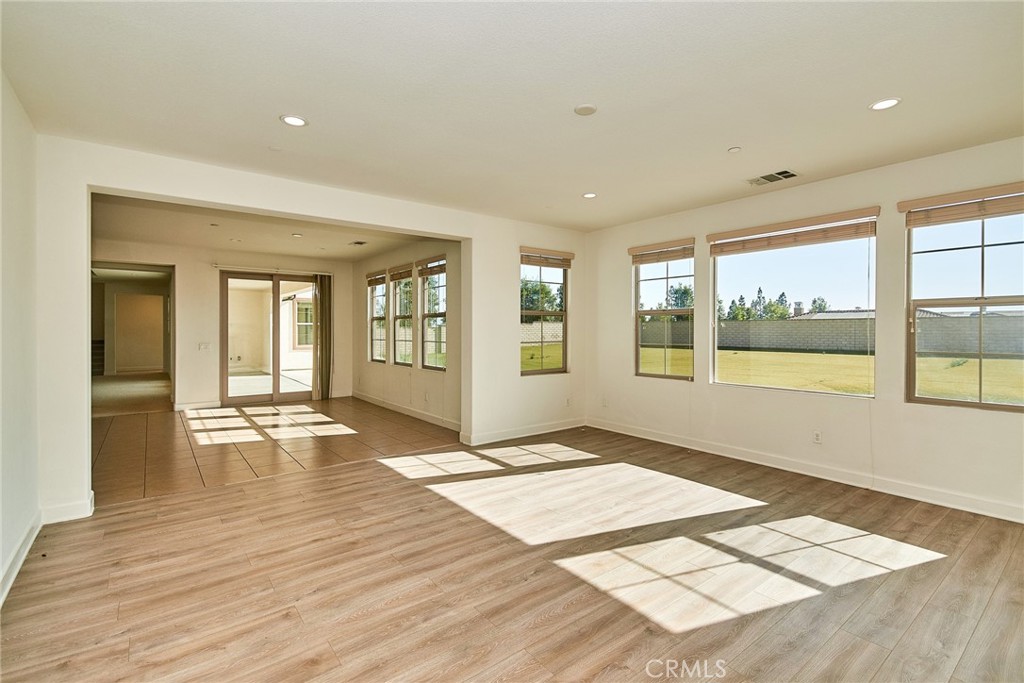 245 Snapdragon Lane Glendora, CA 91741 - Photo 24 of 42 a view of an empty room with wooden floor and a window