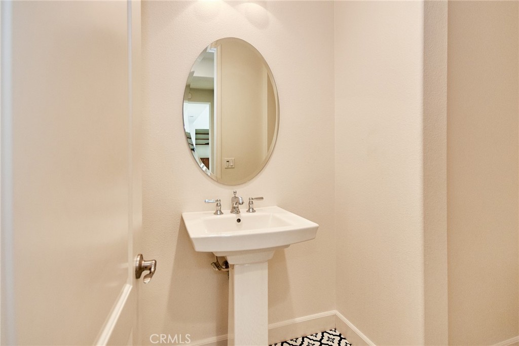 245 Snapdragon Lane Glendora, CA 91741 - Photo 27 of 42 a bathroom with a sink and a mirror