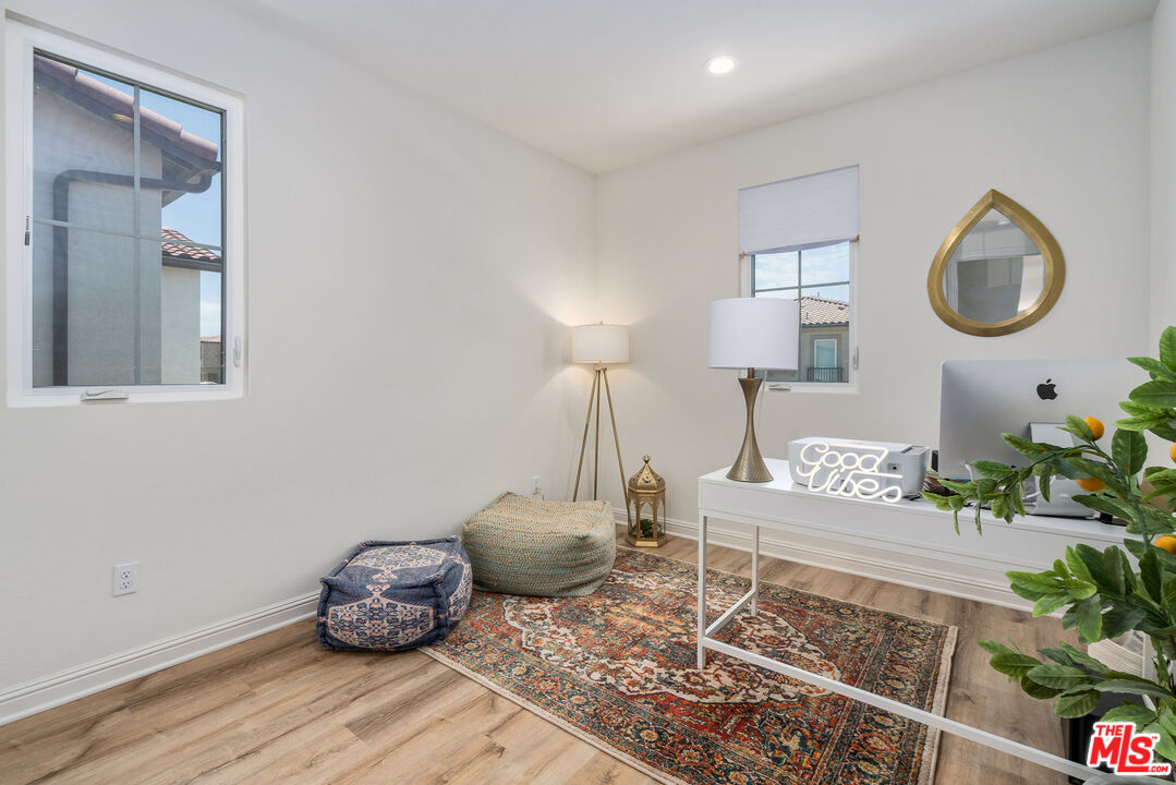 20763 Pine Cone Circle Porter Ranch, CA 91326 - Photo 11 of 20 a living room with furniture and a potted plant