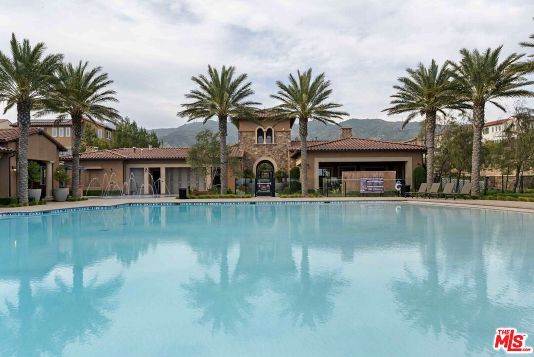 20763 Pine Cone Circle Porter Ranch, CA 91326 - Photo 13 of 20 a front view of house with yard and lake view