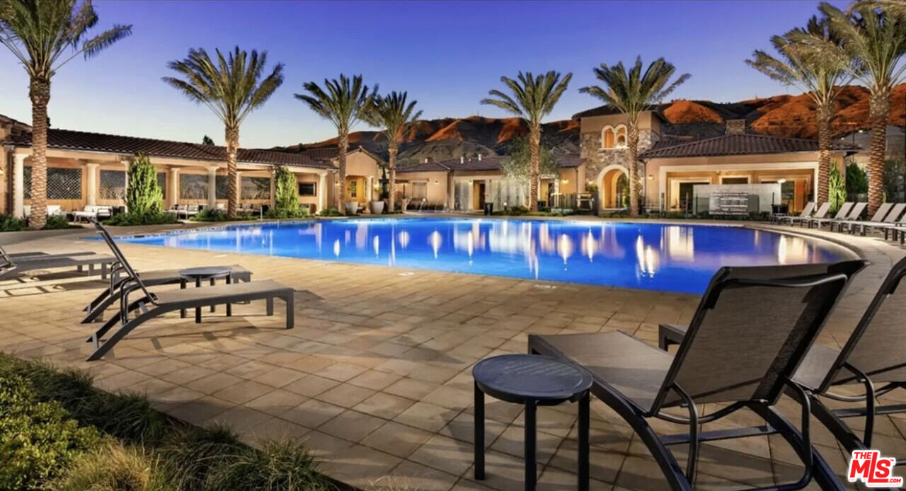 20763 Pine Cone Circle Porter Ranch, CA 91326 - Photo 16 of 20 a view of a chairs and table in a patio