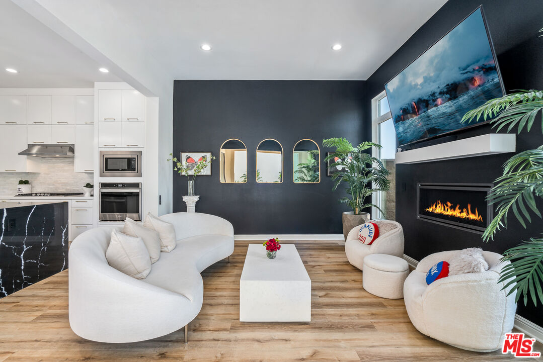 20763 Pine Cone Circle Porter Ranch, CA 91326 - Photo 4 of 20 a living room with furniture and a wooden floor