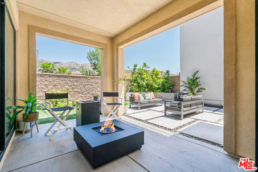 20763 Pine Cone Circle Porter Ranch, CA 91326 - Photo 5 of 20 a living room with furniture a table and a potted plant