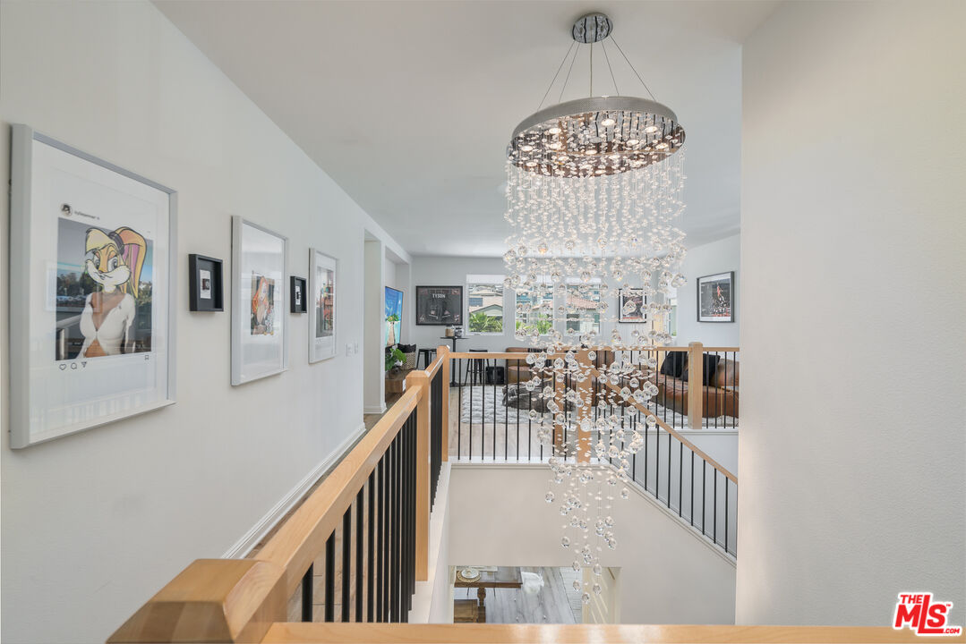 20763 Pine Cone Circle Porter Ranch, CA 91326 - Photo 6 of 20 a view of entryway and hall with a chandelier
