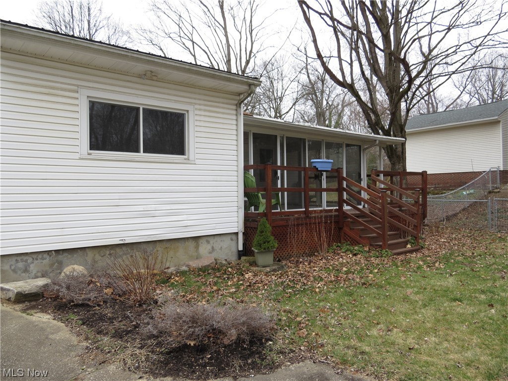 641 Schocalog Road Akron, OH 44320 - Photo 4 of 33 Rear view of property with a sunroom