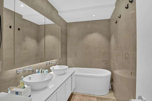 a bedroom with a bed and glass window