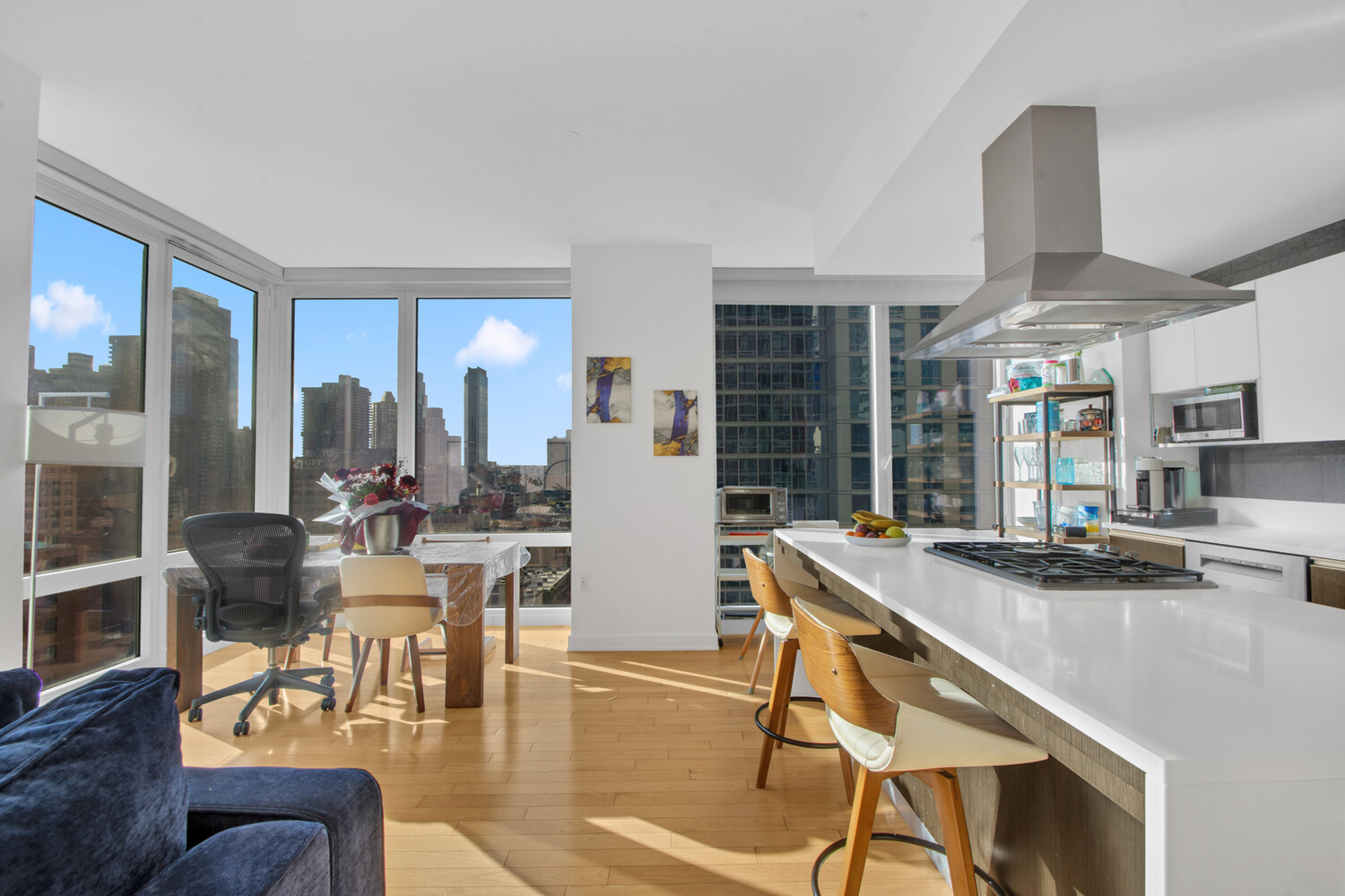 a living room with fireplace furniture and a large window