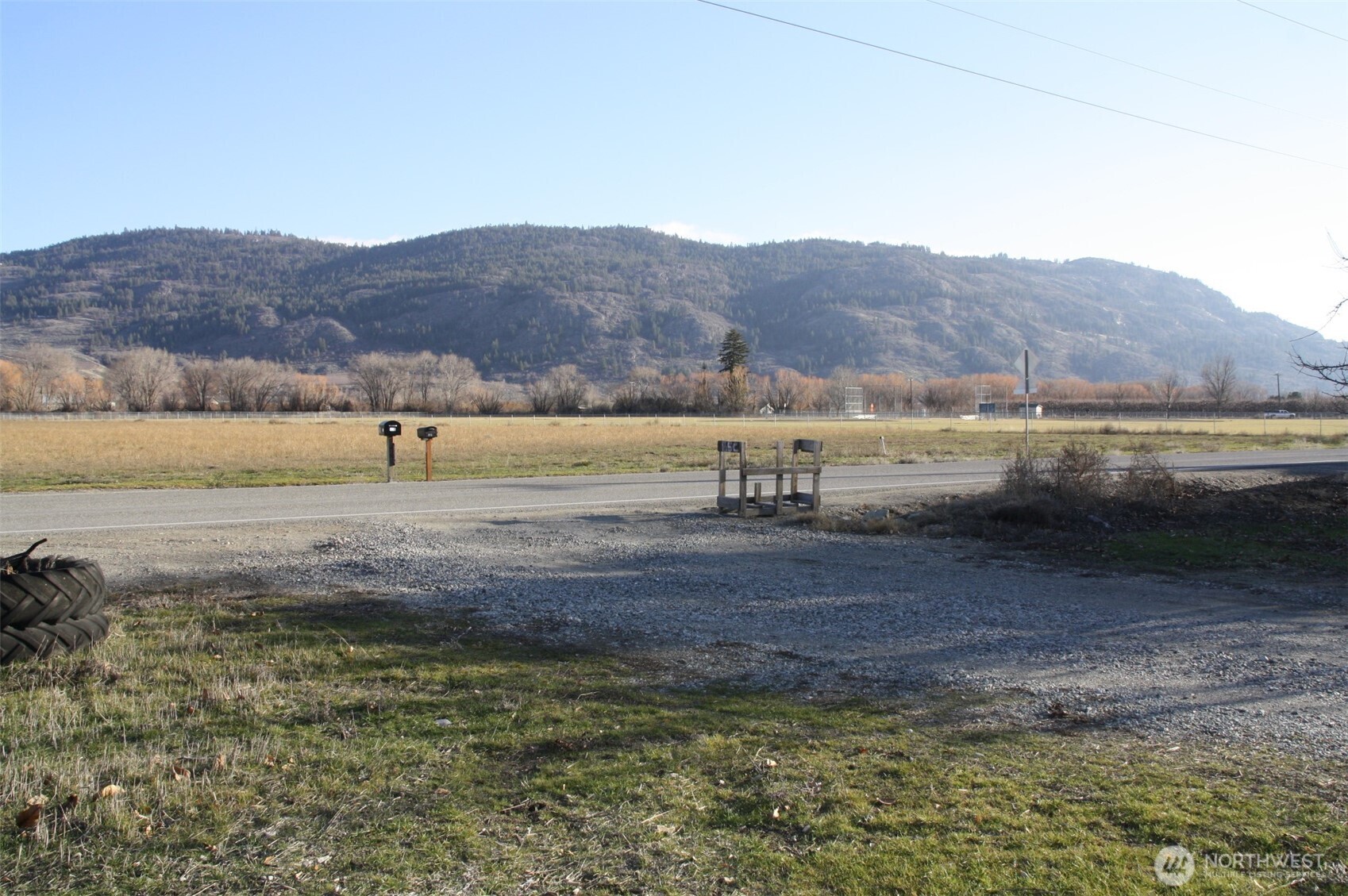 85 Chesaw Road, Unit B Oroville, WA 98844 - Photo 14 of 19 a view of a lake with mountains in the background