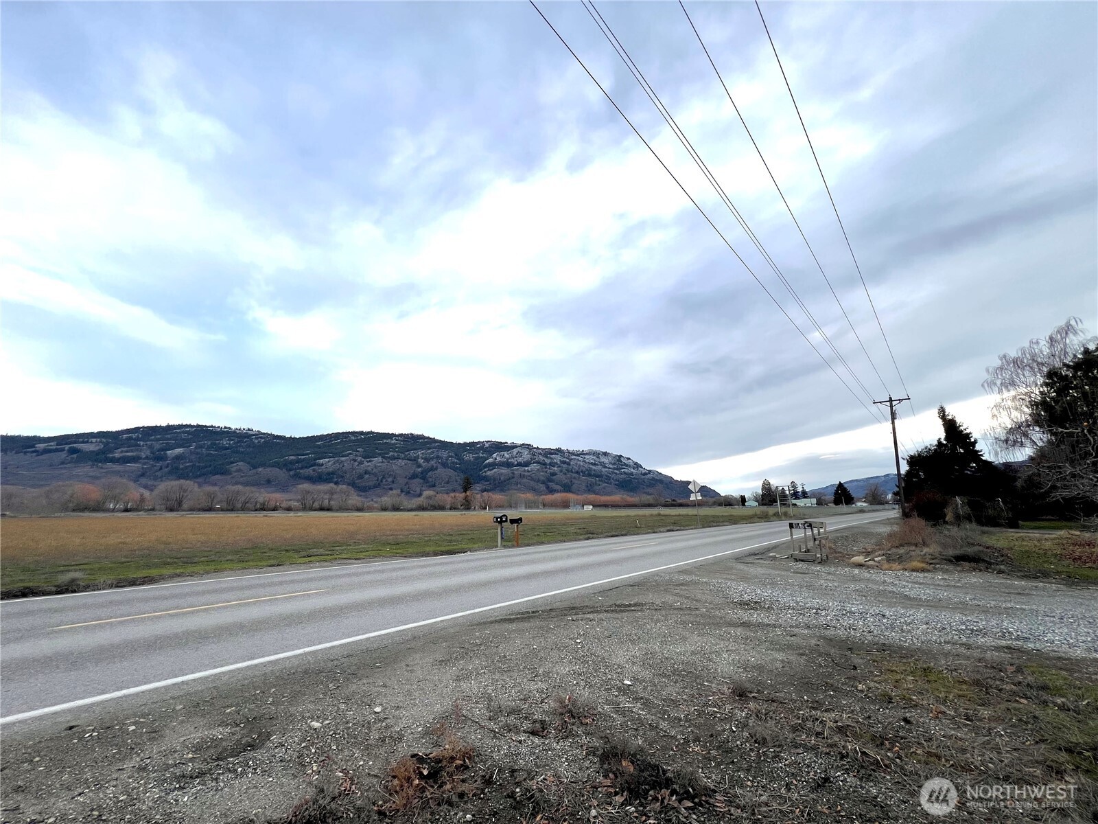 85 Chesaw Road, Unit B Oroville, WA 98844 - Photo 17 of 19 a view of a road with an ocean view