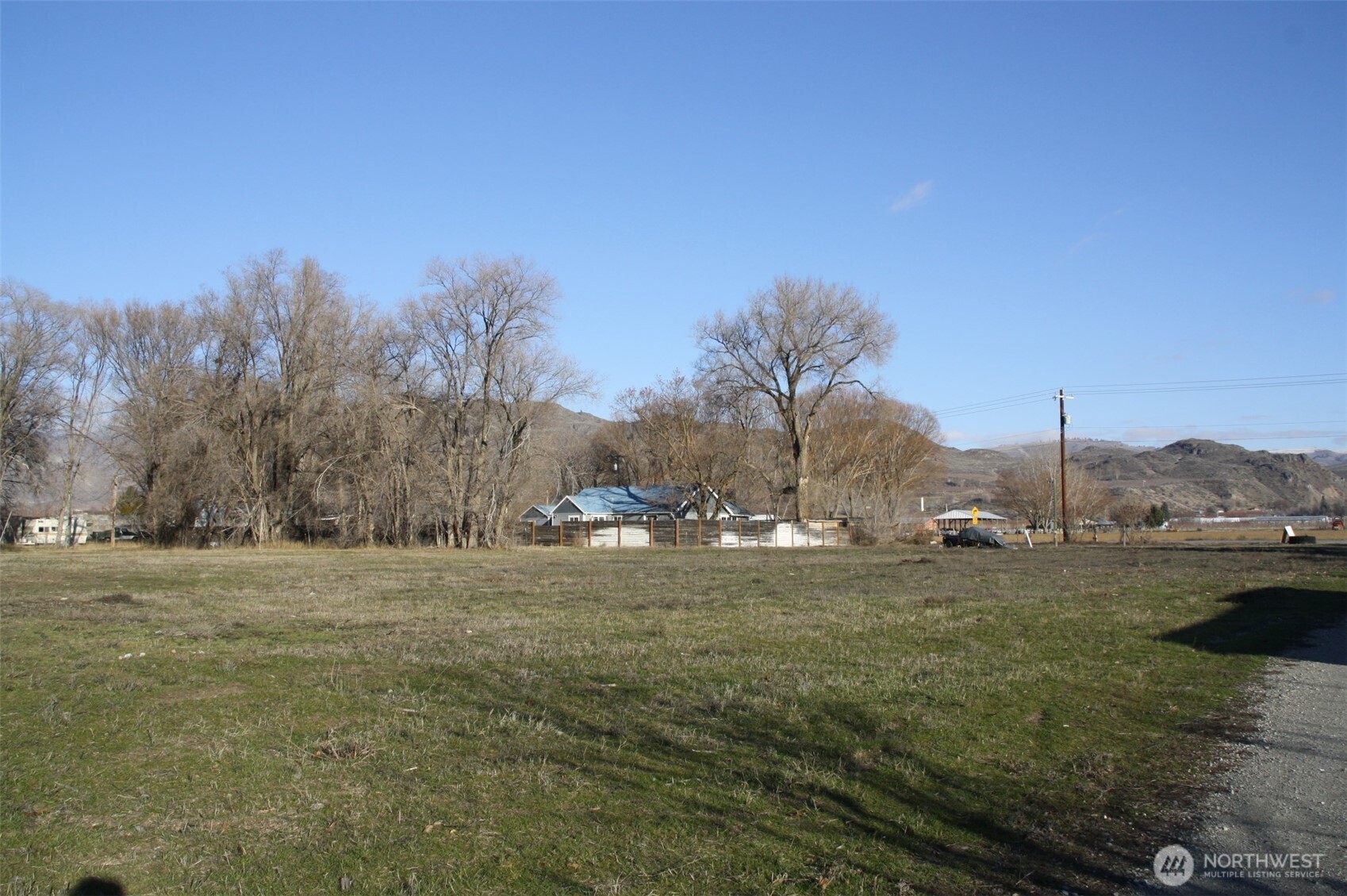 85 Chesaw Road, Unit B Oroville, WA 98844 - Photo 3 of 19 a view of big yard with a house