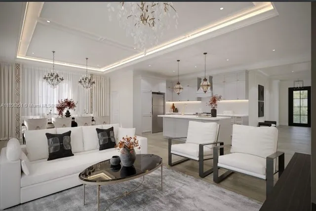 a living room with furniture kitchen and a chandelier