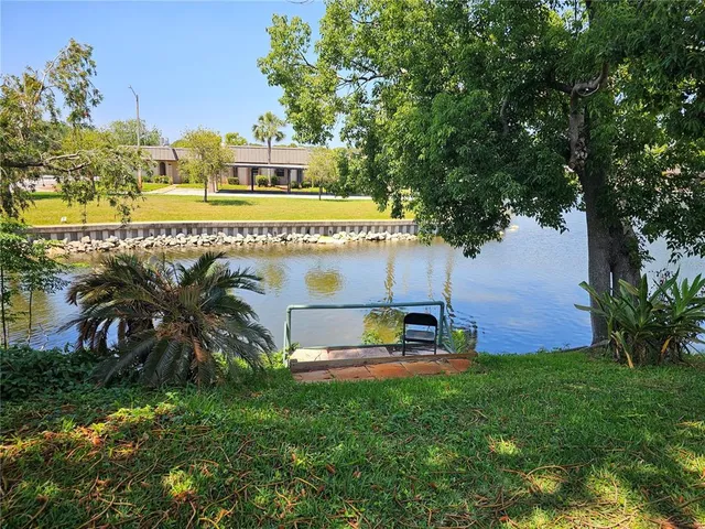 a kitchen with a refrigerator and a stove
