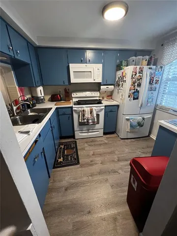 a room with a stove and a microwave