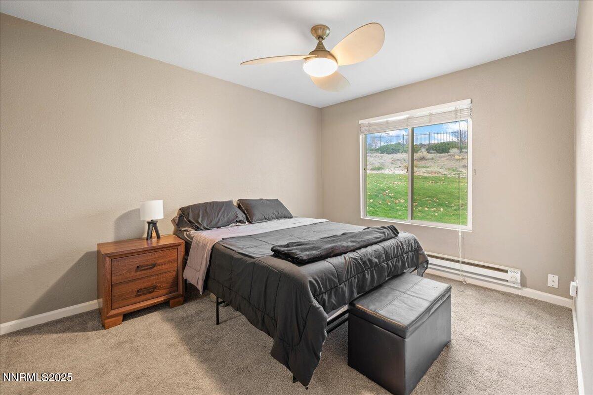 3941 Clear Acre Lane, Unit 237 Reno, NV 89512 - Photo 14 of 26 a bedroom with a bed and a window