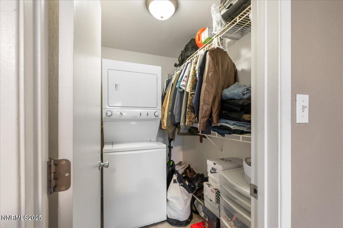 3941 Clear Acre Lane, Unit 237 Reno, NV 89512 - Photo 16 of 26 a view of walk in closet with clothes and shoes
