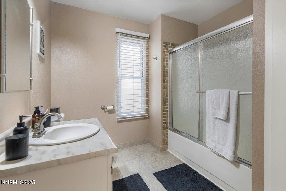 3941 Clear Acre Lane, Unit 237 Reno, NV 89512 - Photo 18 of 26 a bathroom with a sink and mirror
