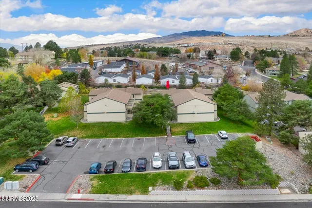 an aerial view of a house with a garden and outdoor space