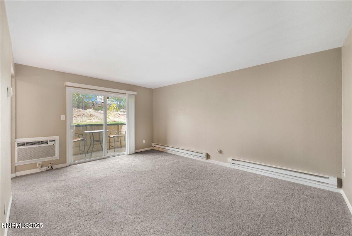3941 Clear Acre Lane, Unit 237 Reno, NV 89512 - Photo 5 of 26 a view of an empty room with a window