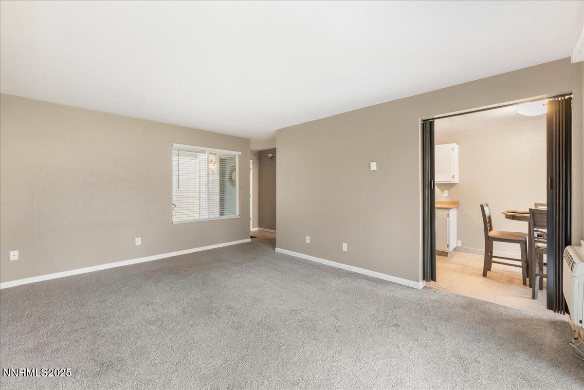 3941 Clear Acre Lane, Unit 237 Reno, NV 89512 - Photo 8 of 26 a view of an empty room with a window