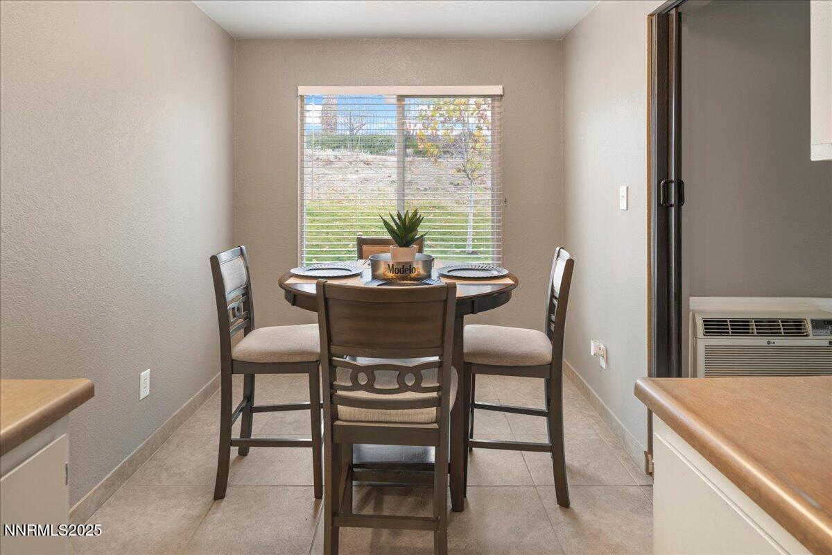 3941 Clear Acre Lane, Unit 237 Reno, NV 89512 - Photo 10 of 26 a dining room with furniture and window