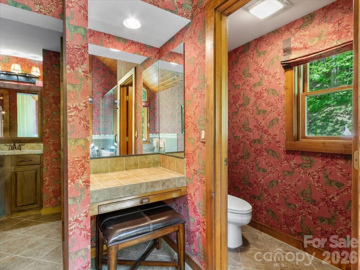 121 Ivy Ridge Road Burnsville, NC 28714 - Photo 23 of 48 a bathroom with a sink a toilet and bathtub