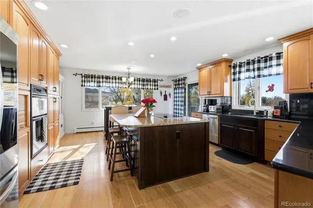 a bed sitting in a spacious bedroom next to a window