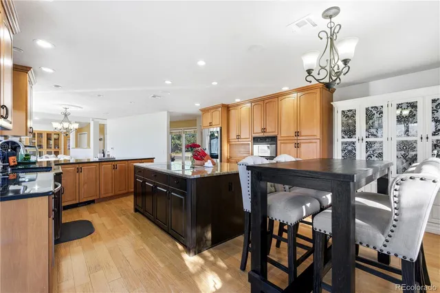 a spacious bathroom with a double vanity sink mirror and bathtub
