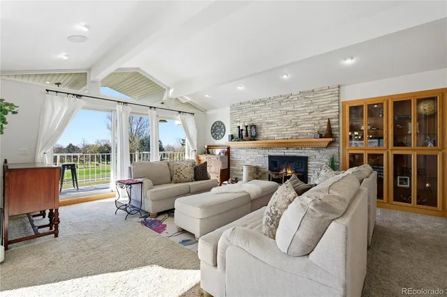 a bedroom with a bed and glass walk in closet