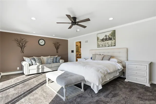 a living room with furniture a flat screen tv and wooden floor