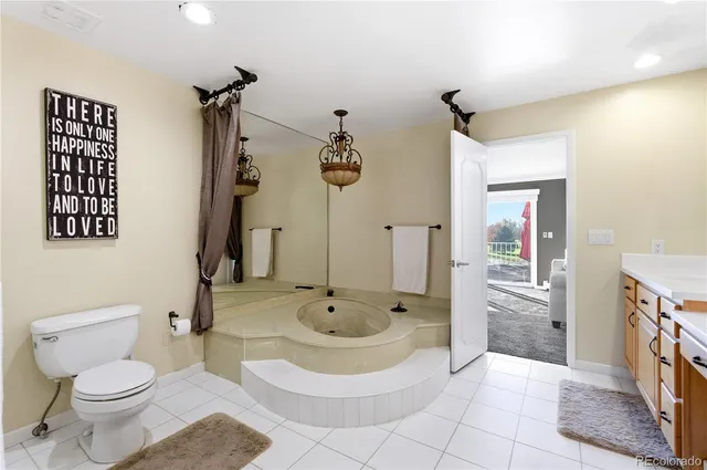 a bedroom with bed and a couch