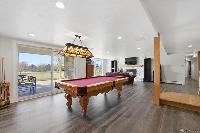 a living room with a table or chairs and a wooden floor