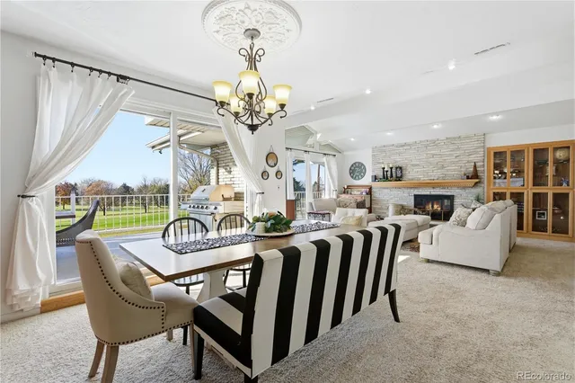a bedroom with a bed flat screen tv and a large window