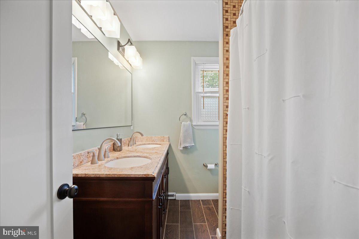 214 Dale Road Pasadena, MD 21122 - Photo 27 of 51 Full bath with title shower and dual vanity