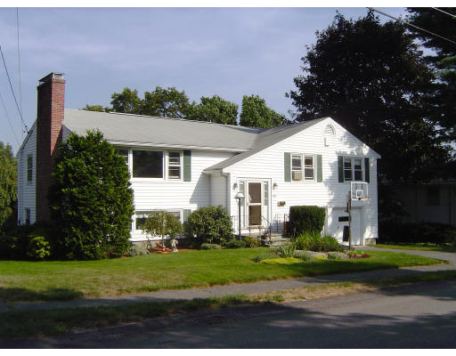 45 Tudor Road Needham, MA 02492 - Photo 1 of 9 a front view of a house with a yard and trees