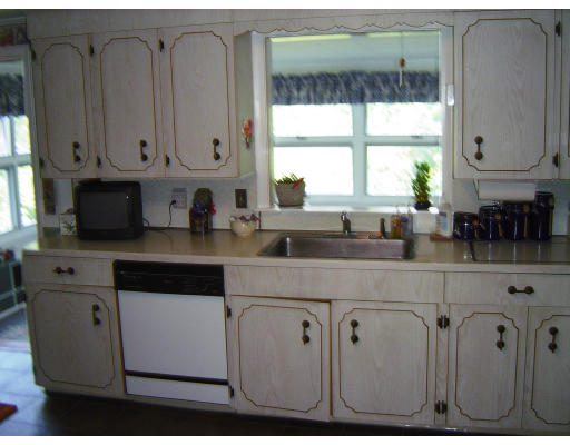 45 Tudor Road Needham, MA 02492 - Photo 3 of 9 a kitchen with granite countertop a sink window and cabinets