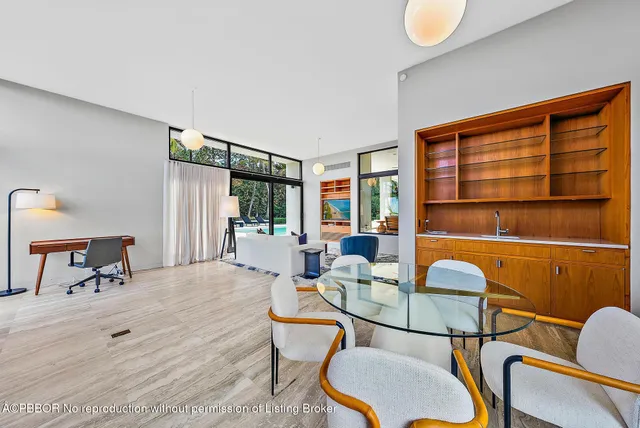 a dining room with a table and chairs