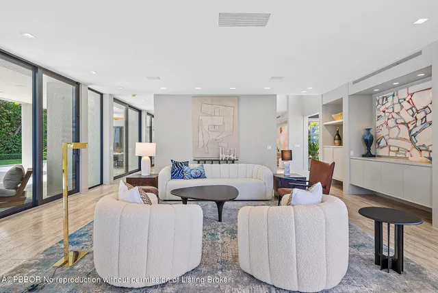 a bathroom with a sink a mirror and a window