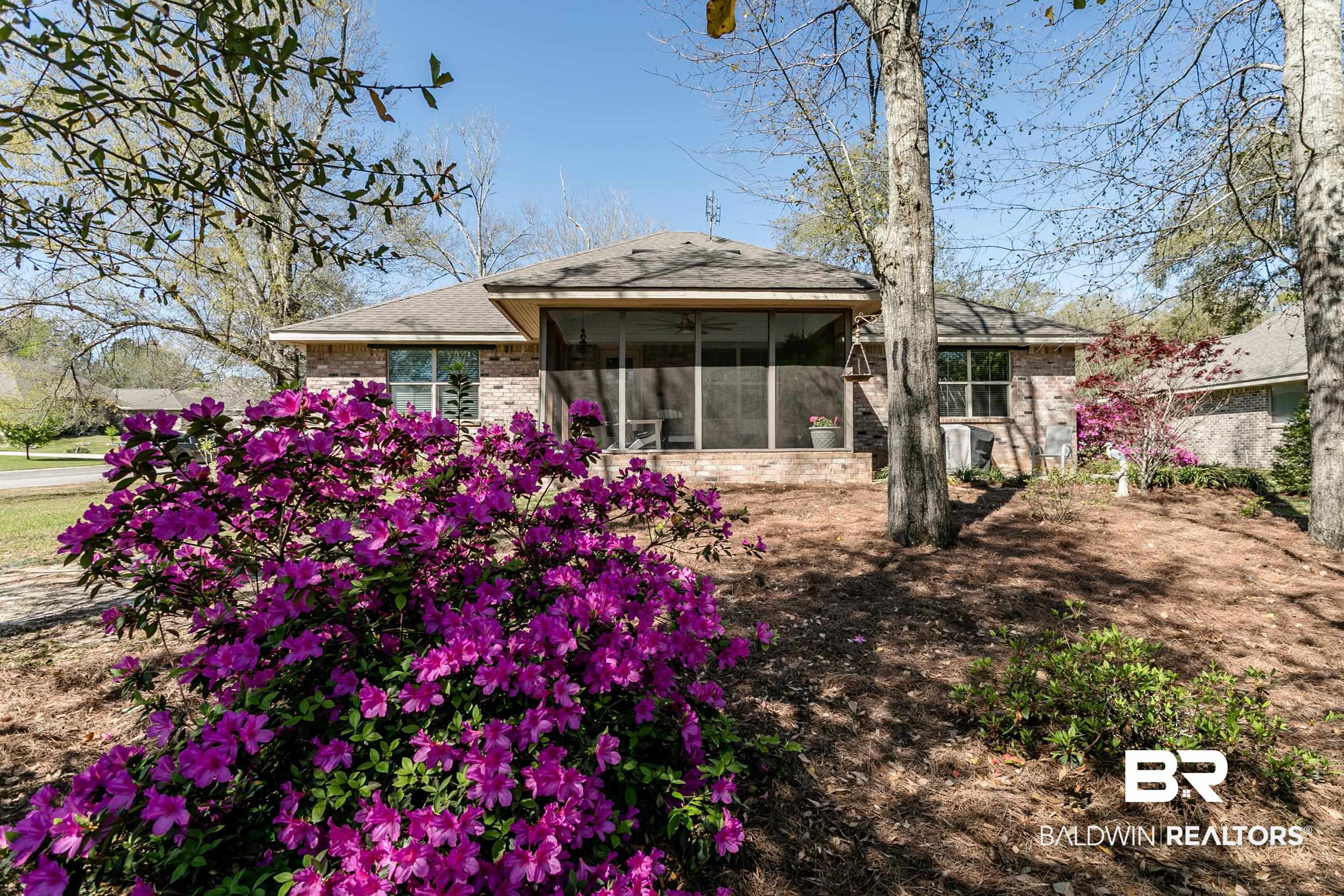 13154 Vincent Court Foley, AL 36535 - Photo 36 of 41 Back of property with a sunroom, brick siding, and roof with shingles
